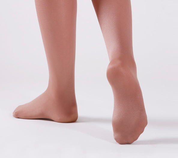 Legs and feet wearing ballet pink footed tights