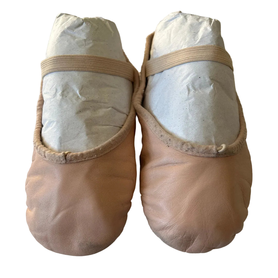 Pair of second hand ballet shoes with drawstrings and elastics