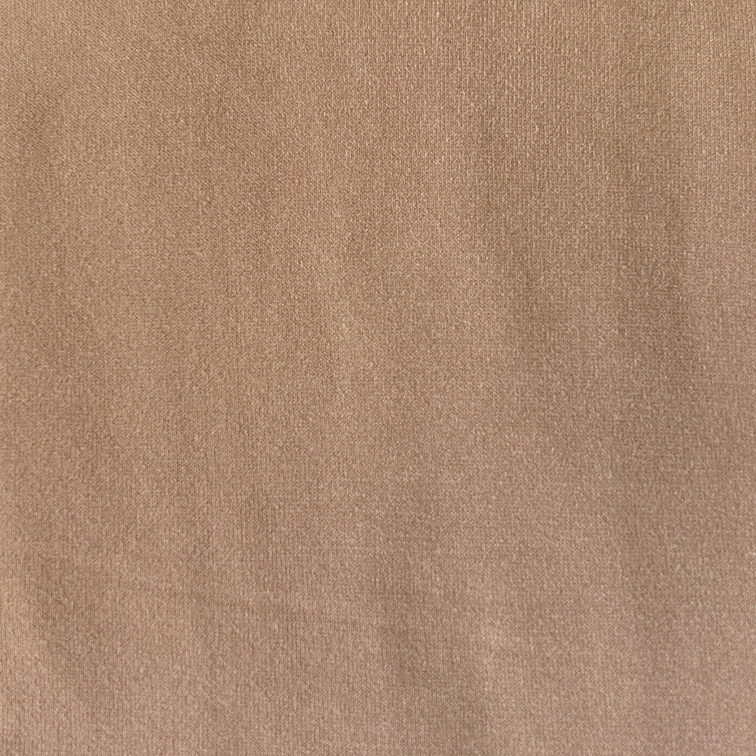 A close-up of a pair of tan tights to show the colour.