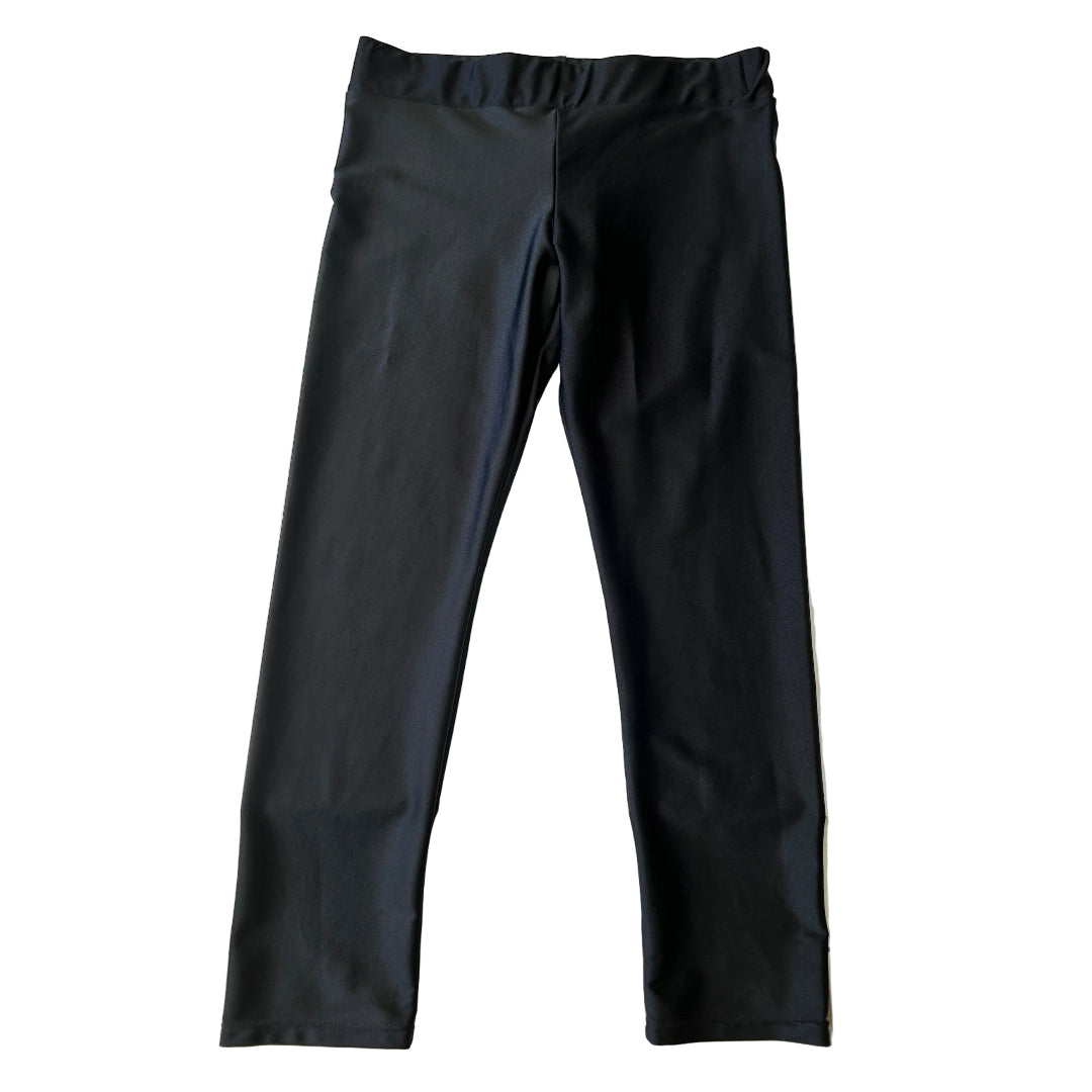 A pair of women's sleek look black leggings on a white background
