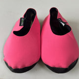 Pair of hot pink shoe covers with black soles
