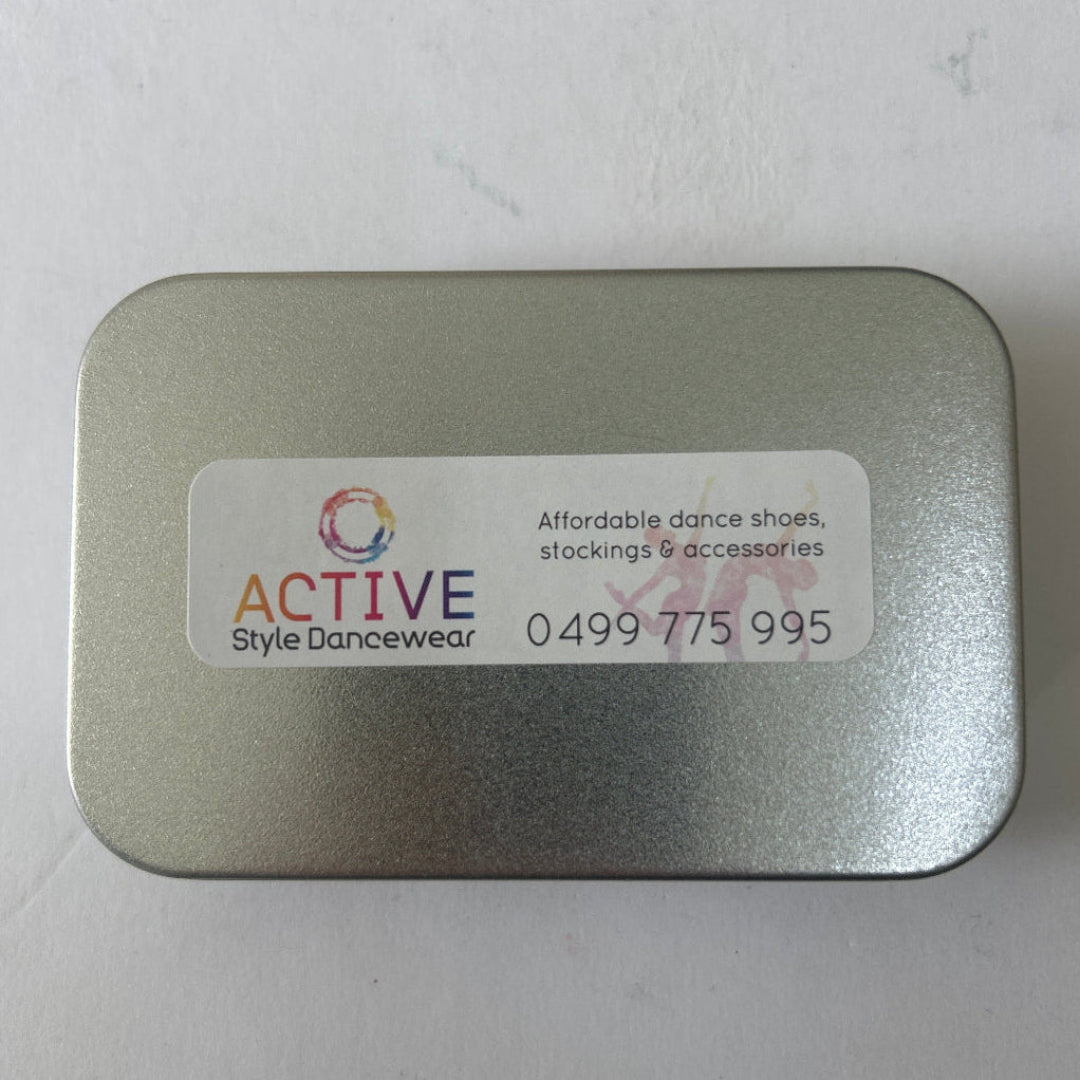 Small silver tin with Active Style Dancewear Sticker on it 