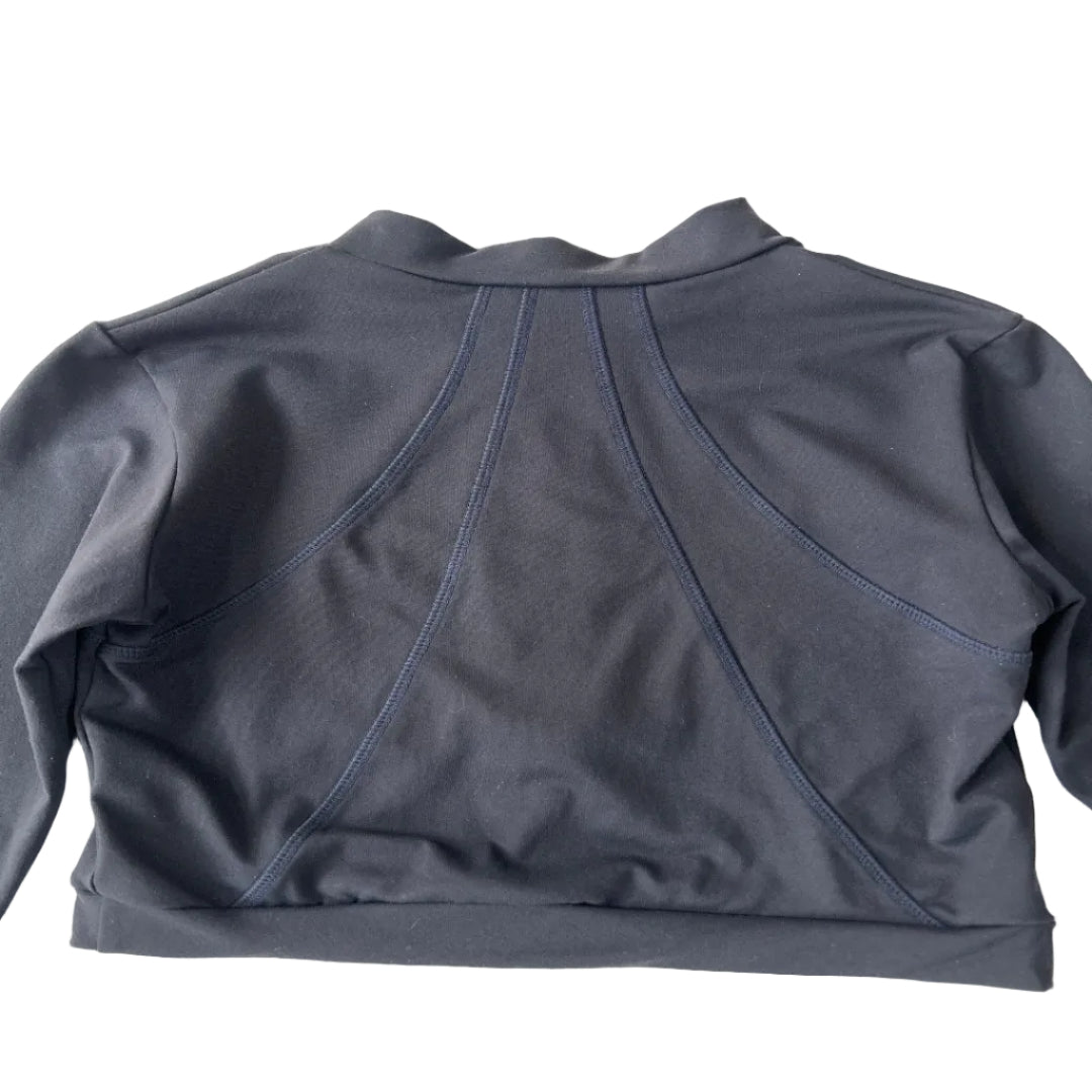 A dark navy blue long-sleeve crop top, featuring a mock neck and distinctive diagonal seam stitching.