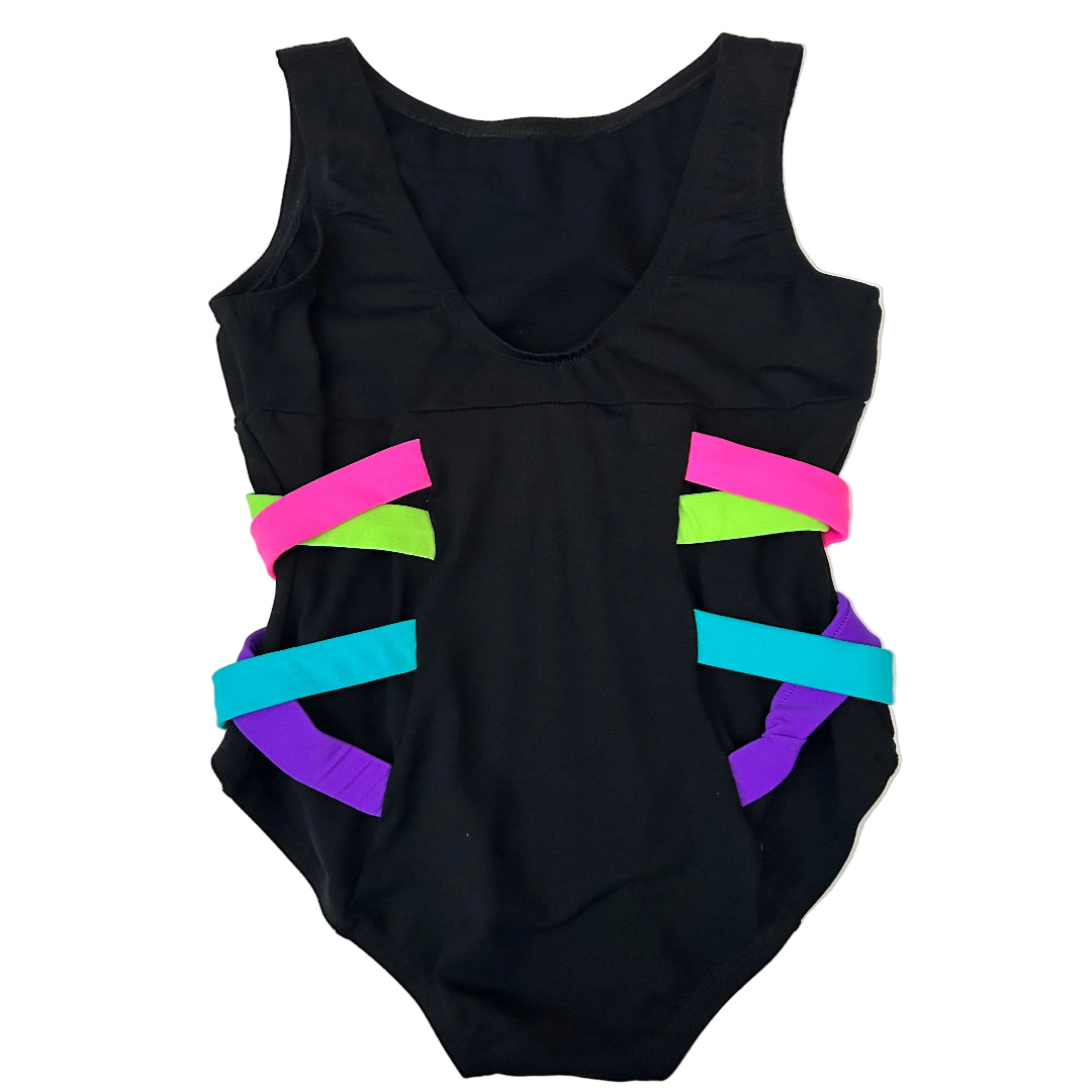 Rear view of a black sleeveless leotard with colorful side criss cross straps in neon green, pink, purple, and turquoise, laid flat on a white surface.