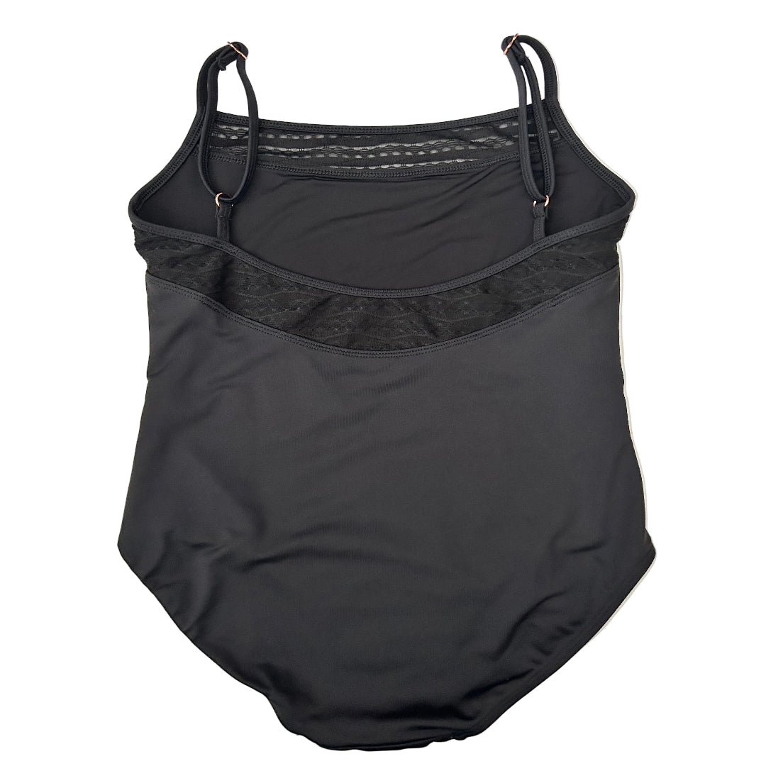 Rear view of a  black leotard with thin shoulder straps, a textured mesh band across the bust, and a small logo on the lower left leg, laid flat on a white surface.