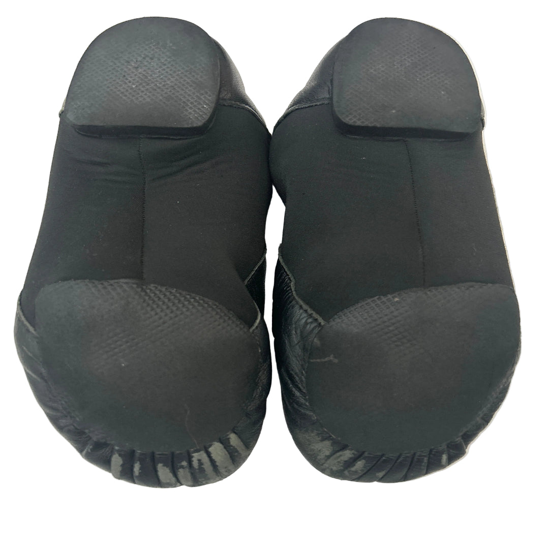 Rear view of a pair of second hand black jazz shoes