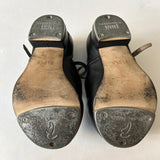 Bottom view of a pair of Black Bloch Buckle Tap Shoes