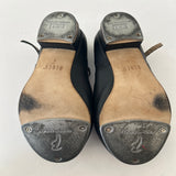 Bottom view of a pair of Bloch Black Buckle Tap Shoes