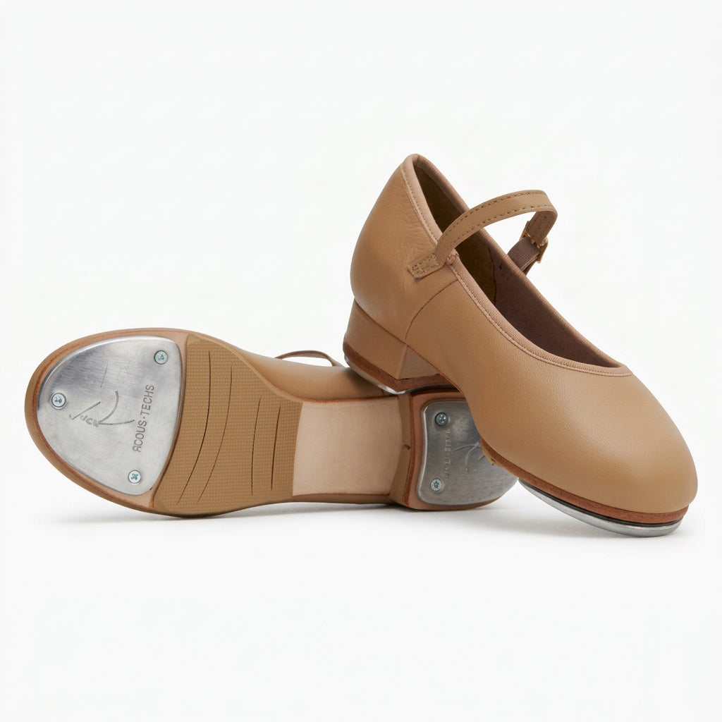 A pair of tan tap shoes on a white background. 